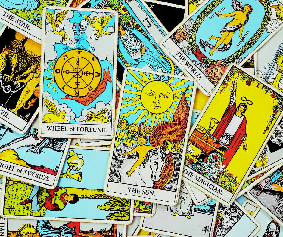 Colorful tarot cards including The Sun, The Magician, and Wheel of Fortune for online tarot reading.