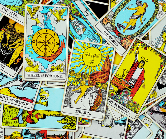 Colorful tarot cards including The Sun, The Magician, and Wheel of Fortune for online tarot reading.