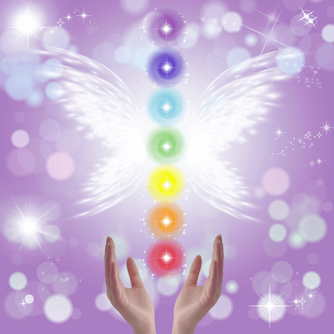 Hands reaching towards a rainbow-colored chakra symbol on a purple background with bokeh effects.